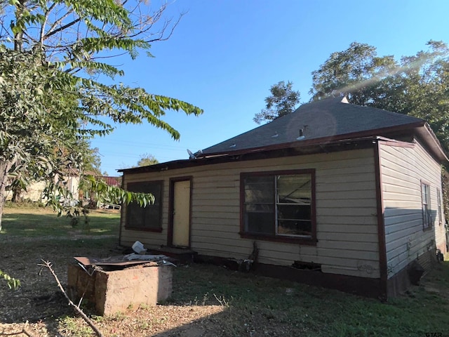 view of home's exterior featuring a lawn