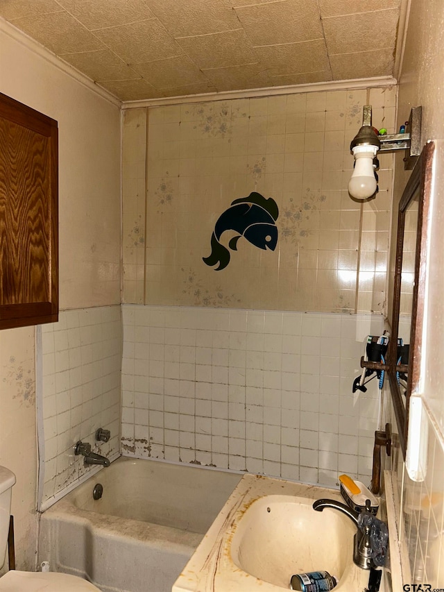 bathroom featuring a washtub, sink, and ornamental molding