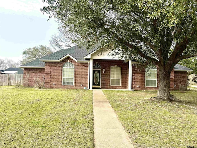 807 Brownwood Cir, Lindale, TX 75771 - ranch-style house featuring a shingled roof and brick siding