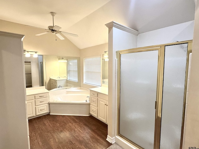 807 Brownwood Cir, Lindale, TX 75771 - bathroom with a ceiling fan, a stall shower, wood finished floors, a bath, and vanity
