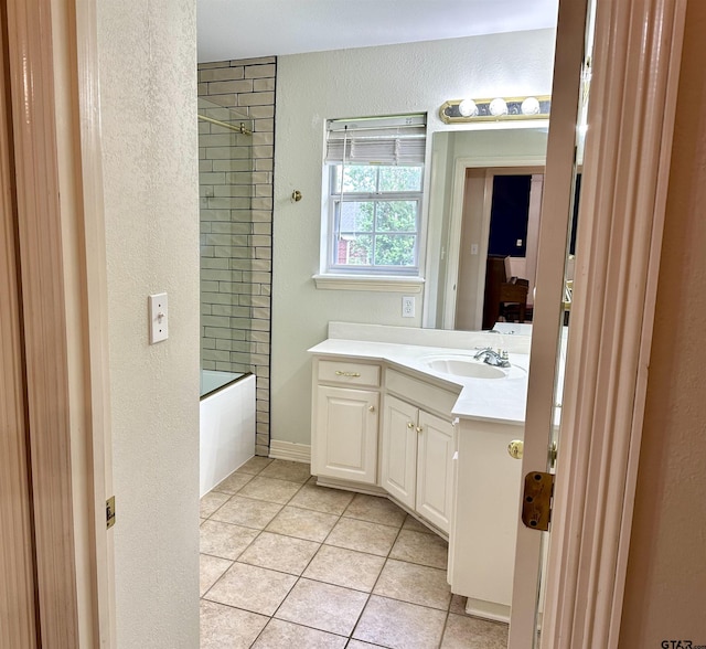 807 Brownwood Cir, Lindale, TX 75771 - bathroom featuring tile patterned floors, vanity, a textured wall, and tub / shower combination