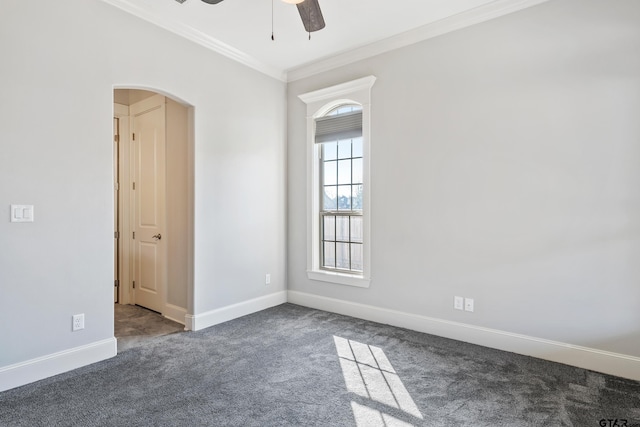 carpeted spare room with ornamental molding and ceiling fan