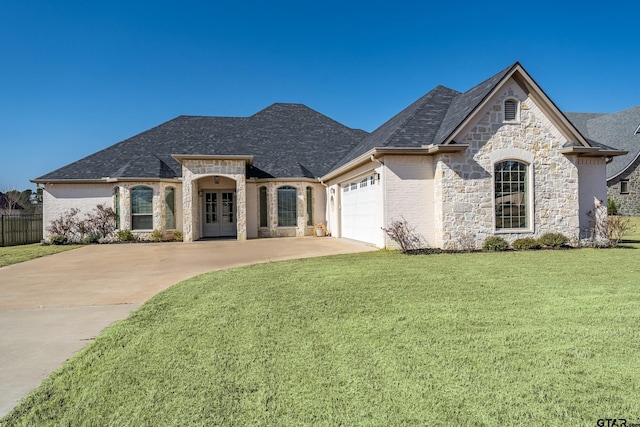 french country inspired facade with a garage and a front lawn