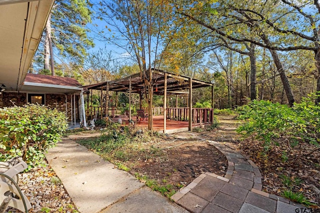 view of yard with a wooden deck