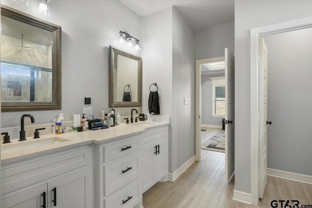 bathroom with vanity and hardwood / wood-style floors