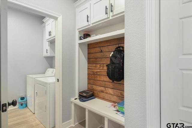 mudroom with washing machine and dryer