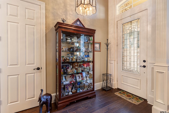 6530 Ashmore Ln, Tyler, TX 75703 - entryway with dark wood-style flooring and a chandelier