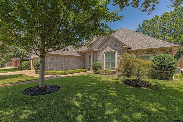 6530 Ashmore Ln, Tyler, TX 75703 - view of front of home with brick siding and a shingled roof