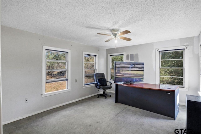 carpeted bedroom with a textured ceiling and ceiling fan