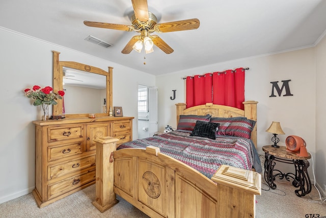 carpeted bedroom with ceiling fan and ornamental molding