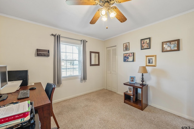 carpeted home office with ornamental molding and ceiling fan