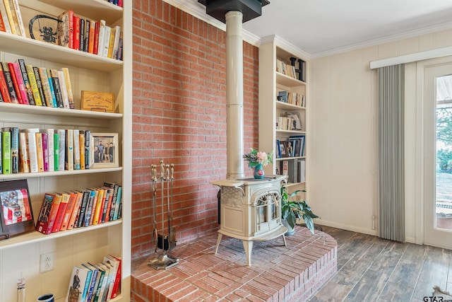 office featuring ornamental molding, a wood stove, and hardwood / wood-style floors