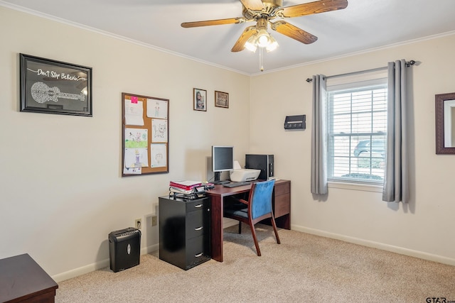 office area with ceiling fan, crown molding, and light carpet