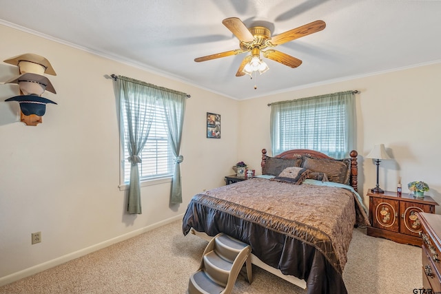 bedroom with light colored carpet, ceiling fan, and crown molding