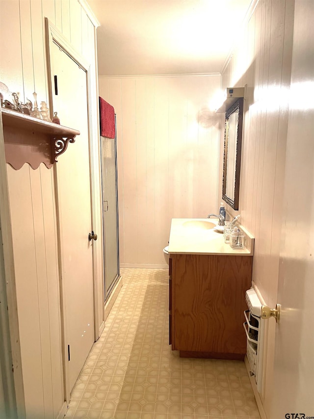 105 Walker Dr, Naples, TX 75568 - full bath featuring vanity, tile patterned floors, crown molding, toilet, and a shower with shower door