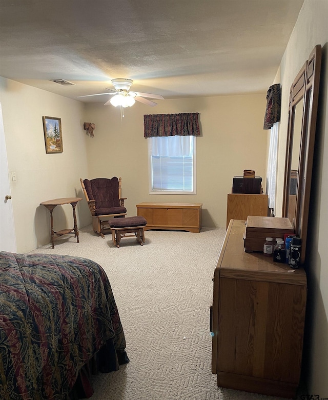 105 Walker Dr, Naples, TX 75568 - bedroom featuring carpet flooring, ceiling fan, and visible vents