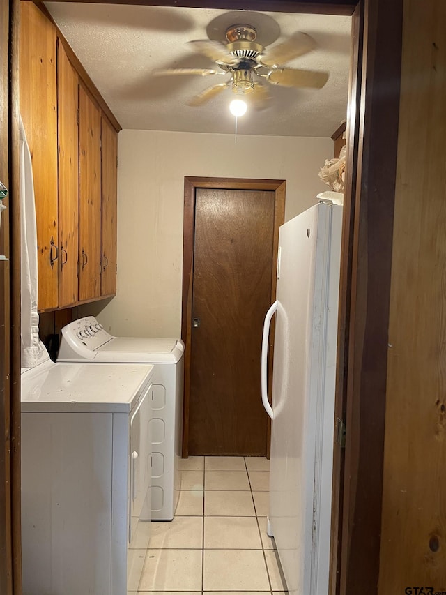 105 Walker Dr, Naples, TX 75568 - laundry room featuring separate washer and dryer, light tile patterned flooring, a ceiling fan, and cabinet space