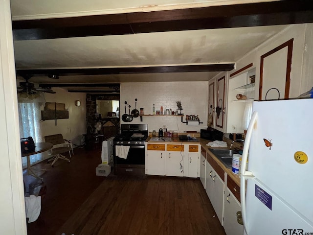 kitchen with sink, white refrigerator, stainless steel range oven, dark hardwood / wood-style floors, and white cabinetry