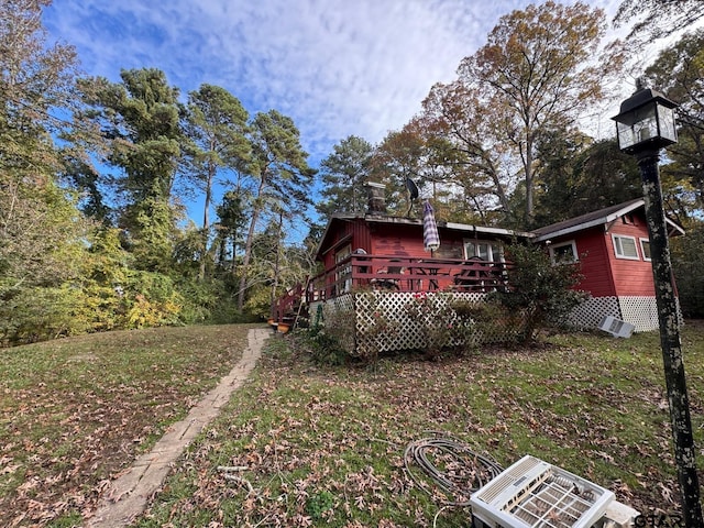 view of yard featuring a wooden deck