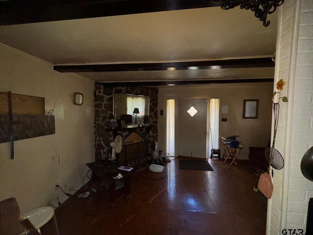 entrance foyer with hardwood / wood-style floors and ornamental molding