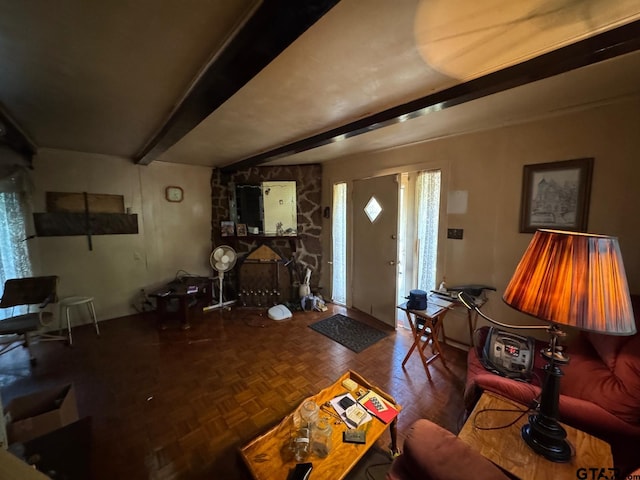 living room featuring parquet flooring and beam ceiling