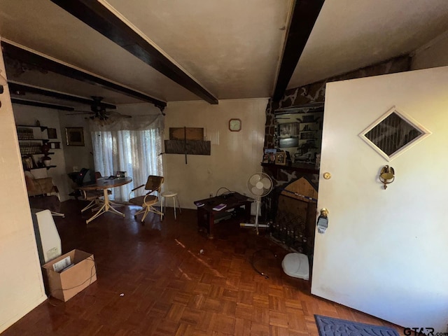 interior space featuring beamed ceiling and dark parquet floors