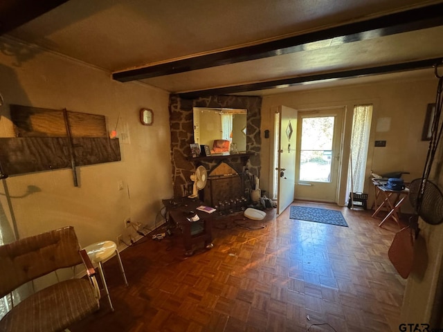 entryway featuring dark parquet floors and beam ceiling