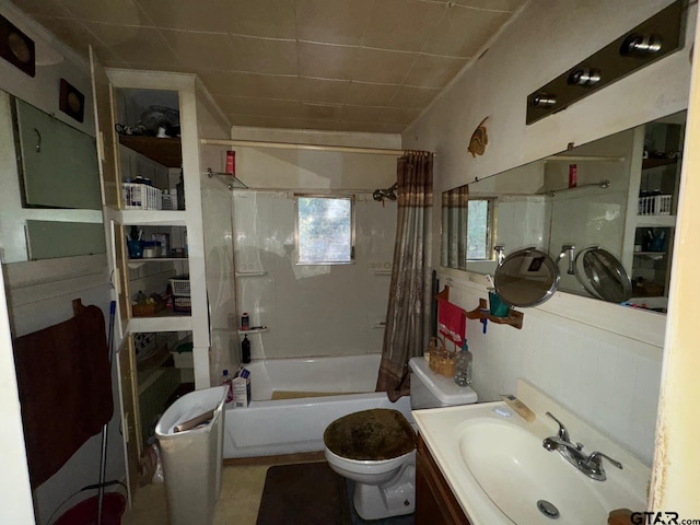 full bathroom with vanity, toilet, and shower / bathtub combination with curtain