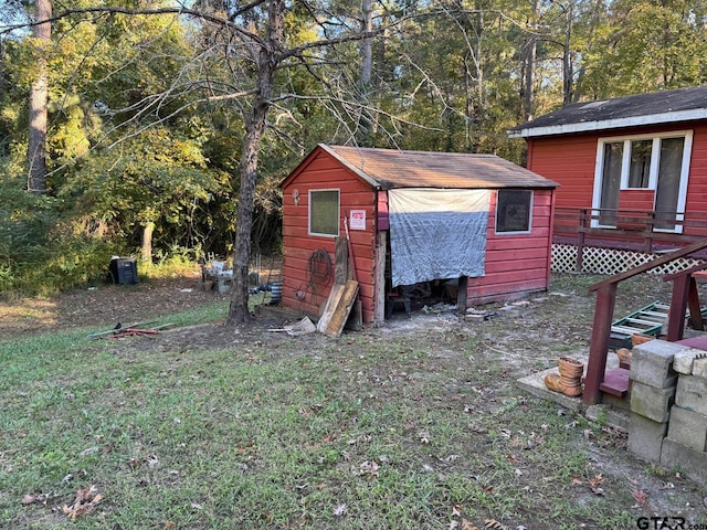 view of outdoor structure with a lawn