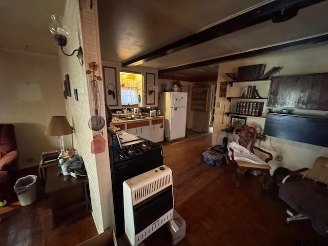 misc room with beam ceiling, dark hardwood / wood-style flooring, sink, and heating unit