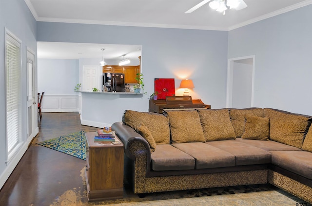 living room with ceiling fan and ornamental molding