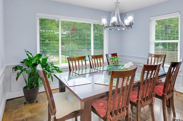 dining space featuring an inviting chandelier