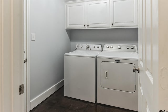 laundry room with cabinets and separate washer and dryer