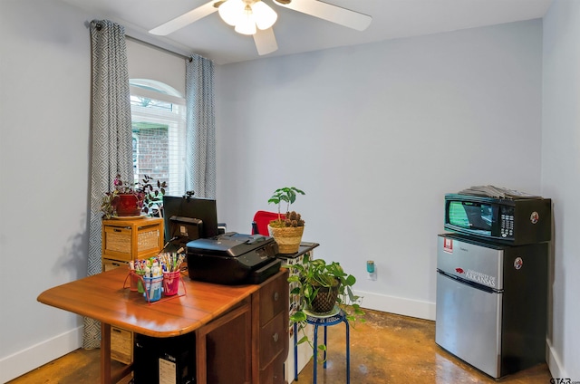 office with concrete flooring and ceiling fan