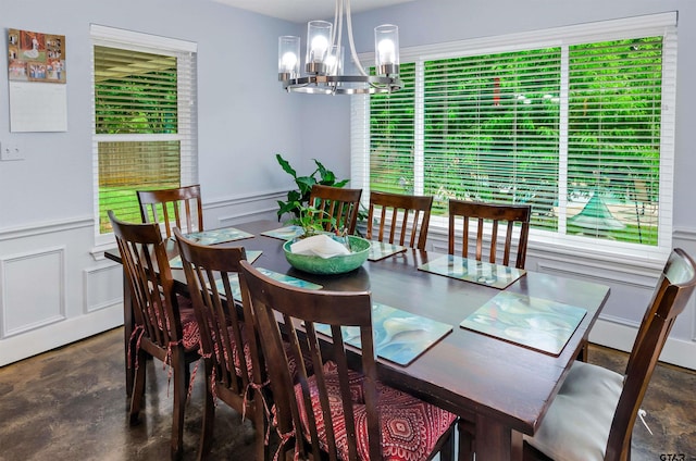 dining area featuring a chandelier