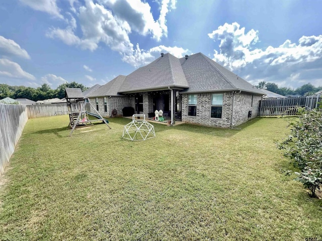 909 Charlie, Whitehouse, TX 75791 - rear view of house with a playground, a shingled roof, and brick siding