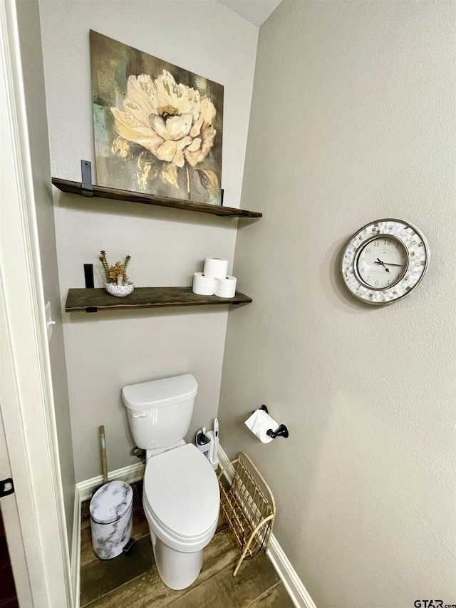 909 Charlie, Whitehouse, TX 75791 - bathroom with baseboards, toilet, and wood finished floors