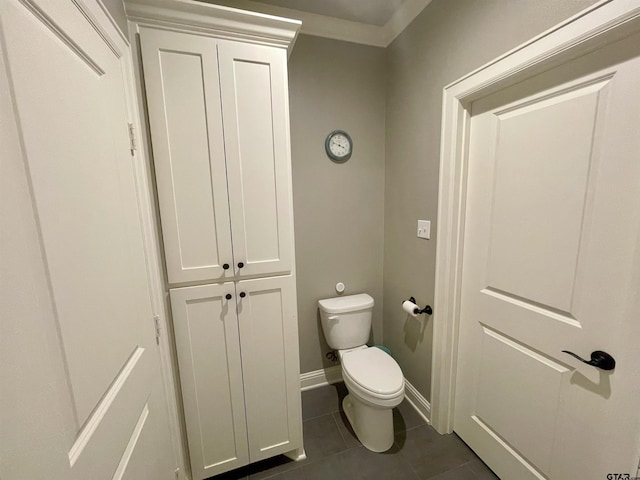 909 Charlie, Whitehouse, TX 75791 - bathroom featuring toilet, tile patterned flooring, ornamental molding, and baseboards