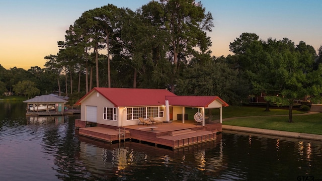 dock area featuring a water view and a yard