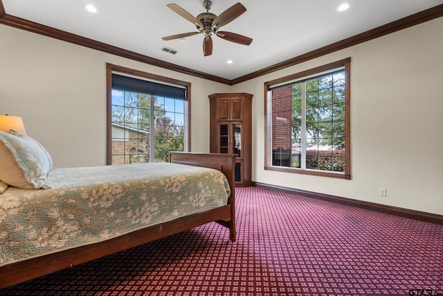 bedroom with crown molding, ceiling fan, and carpet flooring