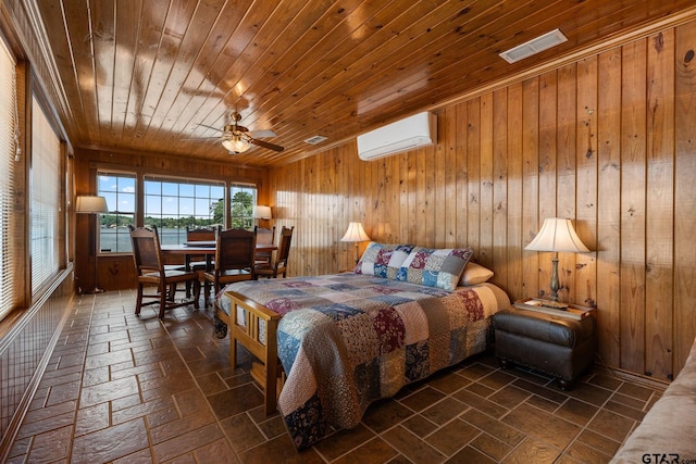 bedroom featuring wood ceiling, wooden walls, and a wall unit AC