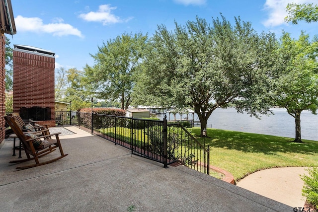 view of patio with a water view