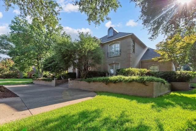 view of home's exterior featuring a yard