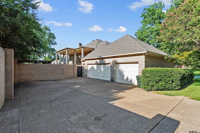 view of side of home featuring a garage