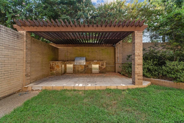 view of patio featuring an outdoor kitchen, a pergola, and a grill