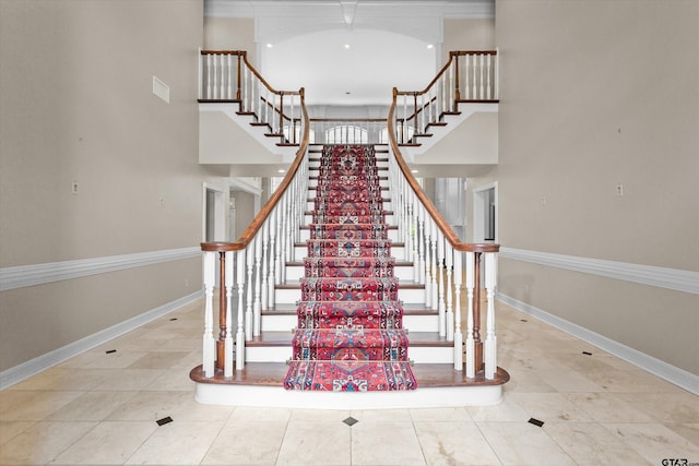 staircase with tile patterned floors