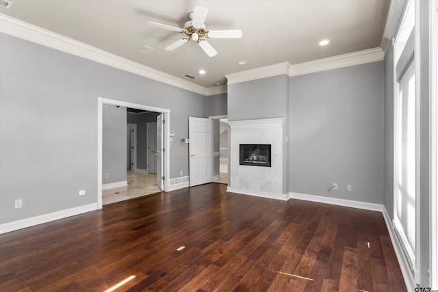 unfurnished living room with a fireplace, dark hardwood / wood-style flooring, ceiling fan, and crown molding