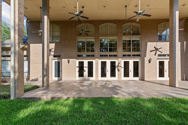 exterior space with ceiling fan, a patio, and french doors