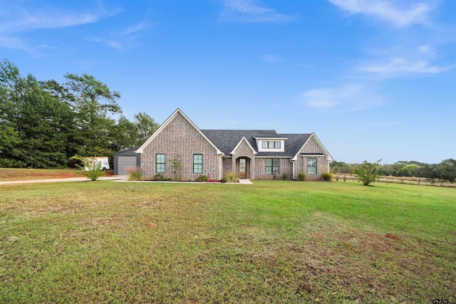 view of front of house featuring a front yard and a garage