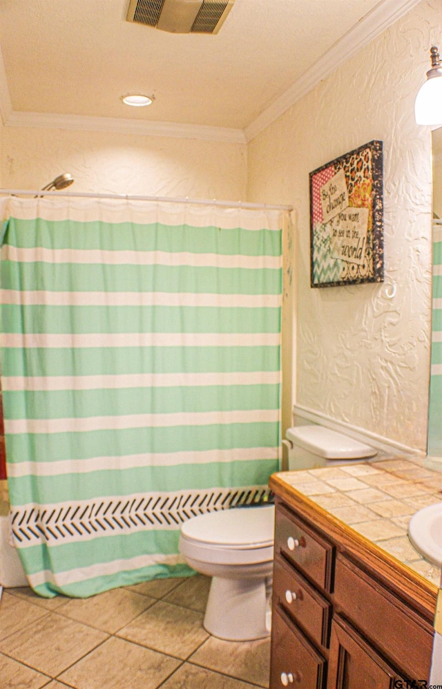 bathroom featuring curtained shower, vanity, tile patterned floors, and crown molding